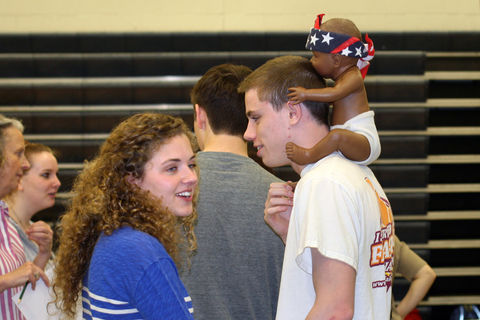Emma Powers (left) and Carter Brown discuss their finances as they wait in the communications line at the Reality Store. The Reality Store is an interactive program that enables high school students to explore balancing a personal budget. —Times-Mirror Staff Photo/Alanna Dvorak